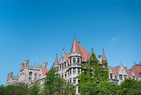 UChicago buildings with blue sky above
